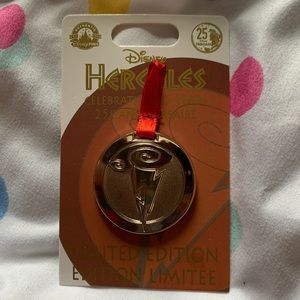 Hercules 25th Anniversary pin with original backer card.